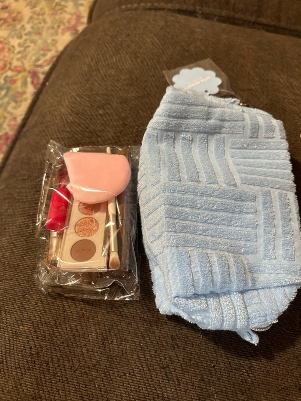 Blue makeup bag with products